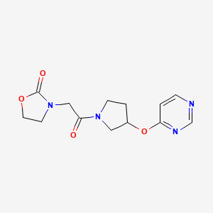 molecular formula C13H16N4O4 B2857072 3-(2-Oxo-2-(3-(pyrimidin-4-yloxy)pyrrolidin-1-yl)ethyl)oxazolidin-2-one CAS No. 2034246-92-7