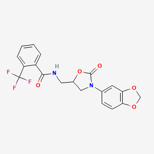 molecular formula C19H15F3N2O5 B2858369 N-((3-(苯并[d][1,3]二氧杂环-5-基)-2-氧代噁唑烷-5-基)甲基)-2-(三氟甲基)苯甲酰胺 CAS No. 955241-31-3