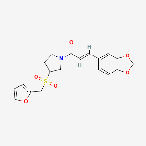molecular formula C19H19NO6S B2858579 (E)-3-(benzo[d][1,3]dioxol-5-yl)-1-(3-((furan-2-ylmethyl)sulfonyl)pyrrolidin-1-yl)prop-2-en-1-one CAS No. 1799262-48-8