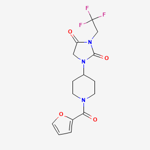 molecular formula C15H16F3N3O4 B2860593 1-[1-(Furan-2-carbonyl)piperidin-4-yl]-3-(2,2,2-trifluoroethyl)imidazolidine-2,4-dione CAS No. 2097916-26-0