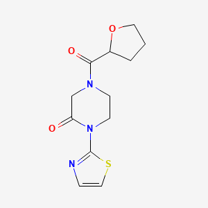 molecular formula C12H15N3O3S B2864118 4-(Tetrahydrofuran-2-carbonyl)-1-(thiazol-2-yl)piperazin-2-one CAS No. 2320444-85-5