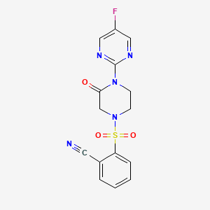 molecular formula C15H12FN5O3S B2865265 2-[4-(5-Fluoropyrimidin-2-yl)-3-oxopiperazin-1-yl]sulfonylbenzonitrile CAS No. 2310123-42-1