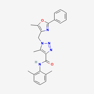 molecular formula C23H23N5O2 B2867211 N-(2,6-dimethylphenyl)-5-methyl-1-((5-methyl-2-phenyloxazol-4-yl)methyl)-1H-1,2,3-triazole-4-carboxamide CAS No. 946254-69-9