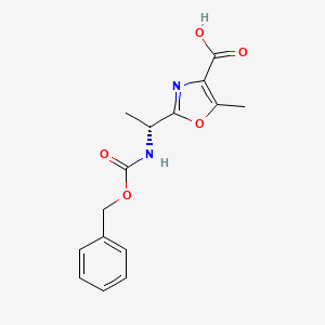 molecular formula C15H16N2O5 B2868046 2-[(1R)-1-{[(benzyloxy)carbonyl]amino}ethyl]-5-methyl-1,3-oxazole-4-carboxylic acid CAS No. 1418113-98-0