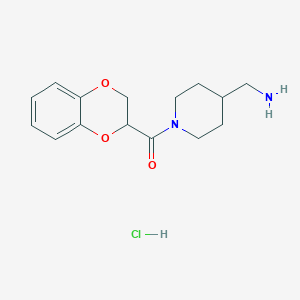 molecular formula C15H21ClN2O3 B2868075 (4-(Aminomethyl)piperidin-1-yl)(2,3-dihydrobenzo[b][1,4]dioxin-2-yl)methanone hydrochloride CAS No. 1353962-72-7