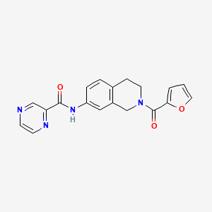 N-(2-(furan-2-carbonyl)-1,2,3,4-tetrahydroisoquinolin-7-yl)pyrazine-2-carboxamide