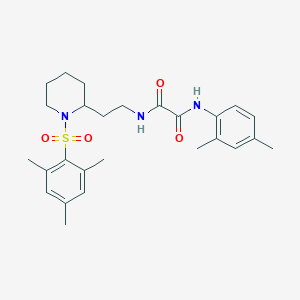 molecular formula C26H35N3O4S B2868652 N1-(2,4-dimethylphenyl)-N2-(2-(1-(mesitylsulfonyl)piperidin-2-yl)ethyl)oxalamide CAS No. 898415-74-2