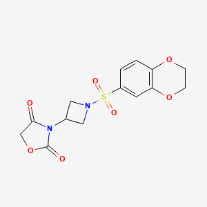molecular formula C14H14N2O7S B2870710 3-(1-((2,3-Dihydrobenzo[b][1,4]dioxin-6-yl)sulfonyl)azetidin-3-yl)oxazolidine-2,4-dione CAS No. 2034426-14-5