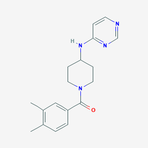 molecular formula C18H22N4O B2871879 (3,4-Dimethylphenyl)-[4-(pyrimidin-4-ylamino)piperidin-1-yl]methanone CAS No. 2415572-85-7