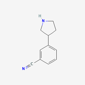 molecular formula C11H12N2 B2872375 Benzonitrile, 3-(3-pyrrolidinyl)- CAS No. 1167049-51-5