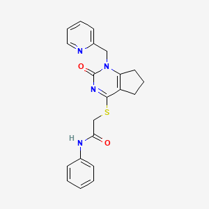 molecular formula C21H20N4O2S B2874284 2-((2-oxo-1-(pyridin-2-ylmethyl)-2,5,6,7-tetrahydro-1H-cyclopenta[d]pyrimidin-4-yl)thio)-N-phenylacetamide CAS No. 946271-10-9