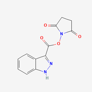 molecular formula C12H9N3O4 B2876044 1-[(1H-indazol-3-ylcarbonyl)oxy]pyrrolidine-2,5-dione CAS No. 1325305-14-3