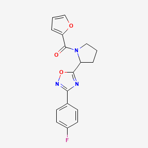 molecular formula C17H14FN3O3 B2876840 3-(4-Fluorophenyl)-5-[1-(2-furoyl)pyrrolidin-2-yl]-1,2,4-oxadiazole CAS No. 1024546-59-5