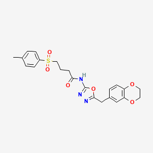 molecular formula C22H23N3O6S B2880296 N-(5-((2,3-dihydrobenzo[b][1,4]dioxin-6-yl)methyl)-1,3,4-oxadiazol-2-yl)-4-tosylbutanamide CAS No. 922048-56-4