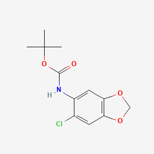 molecular formula C12H14ClNO4 B2881702 tert-butyl N-(6-chloro-1,3-dioxaindan-5-yl)carbamate CAS No. 1485008-99-8