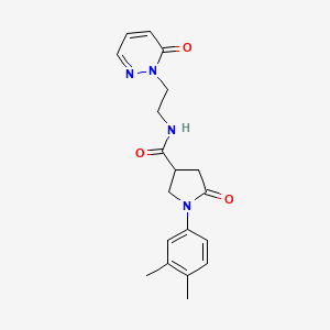 molecular formula C19H22N4O3 B2884214 1-(3,4-dimethylphenyl)-5-oxo-N-(2-(6-oxopyridazin-1(6H)-yl)ethyl)pyrrolidine-3-carboxamide CAS No. 1208530-22-6