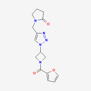 molecular formula C15H17N5O3 B2884762 1-((1-(1-(呋喃-2-羰基)氮杂环丁-3-基)-1H-1,2,3-三唑-4-基)甲基)吡咯烷-2-酮 CAS No. 2034341-68-7
