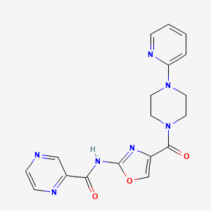 molecular formula C18H17N7O3 B2887690 N-(4-(4-(pyridin-2-yl)piperazine-1-carbonyl)oxazol-2-yl)pyrazine-2-carboxamide CAS No. 1396758-71-6
