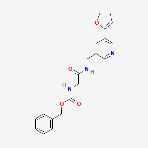 B2893647 Benzyl (2-(((5-(furan-2-yl)pyridin-3-yl)methyl)amino)-2-oxoethyl)carbamate CAS No. 2034519-16-7