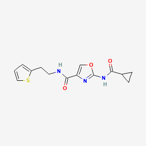 molecular formula C14H15N3O3S B2896871 2-(cyclopropanecarboxamido)-N-(2-(thiophen-2-yl)ethyl)oxazole-4-carboxamide CAS No. 1351622-46-2