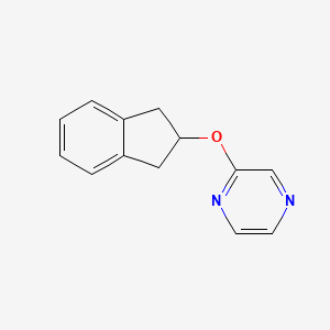 molecular formula C13H12N2O B2900480 2-(2,3-dihydro-1H-inden-2-yloxy)pyrazine CAS No. 2178771-37-2