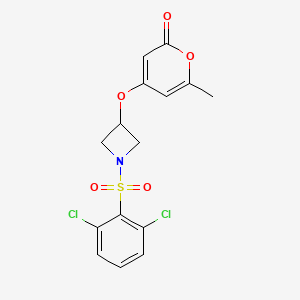 molecular formula C15H13Cl2NO5S B2908521 4-((1-((2,6-dichlorophenyl)sulfonyl)azetidin-3-yl)oxy)-6-methyl-2H-pyran-2-one CAS No. 2034385-56-1