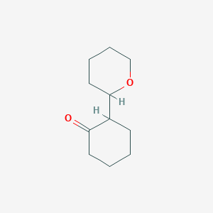 2-(Oxan-2-yl)cyclohexan-1-one