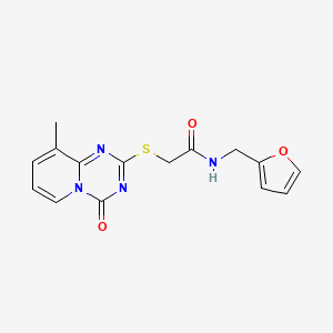 molecular formula C15H14N4O3S B2914851 N-(呋喃-2-基甲基)-2-(9-甲基-4-氧代吡啶并[1,2-a][1,3,5]三嗪-2-基)硫代乙酰胺 CAS No. 896342-31-7