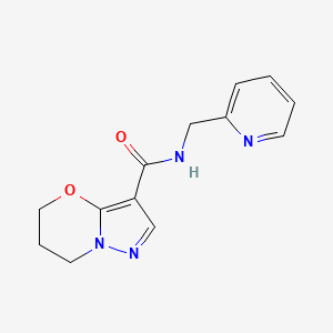 molecular formula C13H14N4O2 B2915422 N-(吡啶-2-基甲基)-6,7-二氢-5H-吡唑并[5,1-b][1,3]恶嗪-3-甲酰胺 CAS No. 1421482-53-2