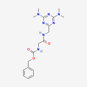 molecular formula C18H25N7O3 B2918289 苯甲酸苄酯 (2-(((4,6-双(二甲氨基)-1,3,5-三嗪-2-基)甲基)氨基)-2-氧代乙基)氨基甲酸酯 CAS No. 2034356-65-3