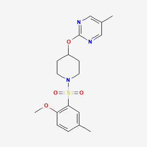 B2937833 2-[1-(2-Methoxy-5-methylphenyl)sulfonylpiperidin-4-yl]oxy-5-methylpyrimidine CAS No. 2379977-54-3