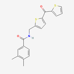 molecular formula C19H17NO2S2 B2939472 3,4-Dimethyl-N-{[5-(thiophene-2-carbonyl)thiophen-2-YL]methyl}benzamide CAS No. 1421441-61-3
