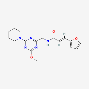 (E)-3-(furan-2-yl)-N-((4-methoxy-6-(piperidin-1-yl)-1,3,5-triazin-2-yl)methyl)acrylamide