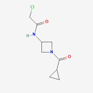 molecular formula C9H13ClN2O2 B2944530 2-Chloro-N-[1-(cyclopropanecarbonyl)azetidin-3-yl]acetamide CAS No. 2411284-68-7