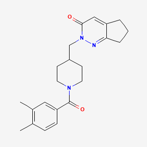 molecular formula C22H27N3O2 B2945861 2-[[1-(3,4-Dimethylbenzoyl)piperidin-4-yl]methyl]-6,7-dihydro-5H-cyclopenta[c]pyridazin-3-one CAS No. 2379994-21-3