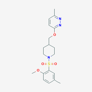molecular formula C19H25N3O4S B2948546 3-[[1-(2-Methoxy-5-methylphenyl)sulfonylpiperidin-4-yl]methoxy]-6-methylpyridazine CAS No. 2379994-44-0