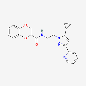 molecular formula C22H22N4O3 B2952006 N-(2-(5-cyclopropyl-3-(pyridin-2-yl)-1H-pyrazol-1-yl)ethyl)-2,3-dihydrobenzo[b][1,4]dioxine-2-carboxamide CAS No. 1797327-94-6