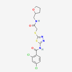 2,4-dichloro-N-(5-((2-oxo-2-(((tetrahydrofuran-2-yl)methyl)amino)ethyl)thio)-1,3,4-thiadiazol-2-yl)benzamide