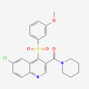 molecular formula C22H21ClN2O4S B2958660 6-Chloro-4-[(3-methoxyphenyl)sulfonyl]-3-(piperidin-1-ylcarbonyl)quinoline CAS No. 1111147-12-6