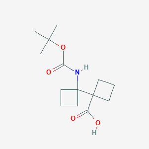 molecular formula C14H23NO4 B2960904 1-[1-[(2-Methylpropan-2-yl)oxycarbonylamino]cyclobutyl]cyclobutane-1-carboxylic acid CAS No. 2228264-91-1