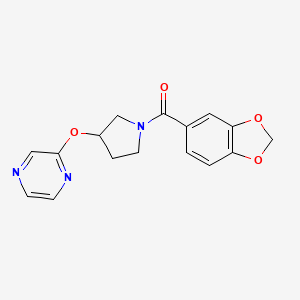 molecular formula C16H15N3O4 B2961005 Benzo[d][1,3]dioxol-5-yl(3-(pyrazin-2-yloxy)pyrrolidin-1-yl)methanone CAS No. 2034449-17-5