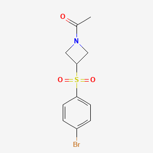 molecular formula C11H12BrNO3S B2962212 1-{3-[(4-Bromobenzene)sulfonyl]azetidin-1-yl}ethanone CAS No. 2222512-01-6