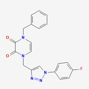 molecular formula C20H16FN5O2 B2965239 1-Benzyl-4-[[1-(4-fluorophenyl)triazol-4-yl]methyl]pyrazine-2,3-dione CAS No. 2380044-20-0