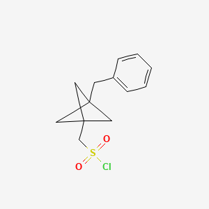 (3-Benzyl-1-bicyclo[1.1.1]pentanyl)methanesulfonyl chloride