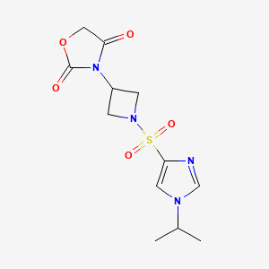 molecular formula C12H16N4O5S B2973887 3-(1-((1-isopropyl-1H-imidazol-4-yl)sulfonyl)azetidin-3-yl)oxazolidine-2,4-dione CAS No. 2034359-33-4