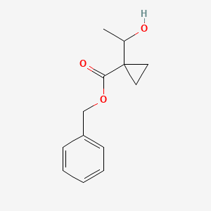 molecular formula C13H16O3 B2980327 Benzyl 1-(1-hydroxyethyl)cyclopropanecarboxylate CAS No. 1447944-25-3