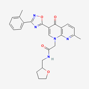 2-(7-methyl-4-oxo-3-(3-(o-tolyl)-1,2,4-oxadiazol-5-yl)-1,8-naphthyridin-1(4H)-yl)-N-((tetrahydrofuran-2-yl)methyl)acetamide