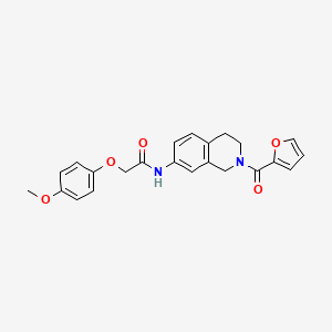 molecular formula C23H22N2O5 B2981067 N-(2-(呋喃-2-羰基)-1,2,3,4-四氢异喹啉-7-基)-2-(4-甲氧基苯氧基)乙酰胺 CAS No. 955639-89-1
