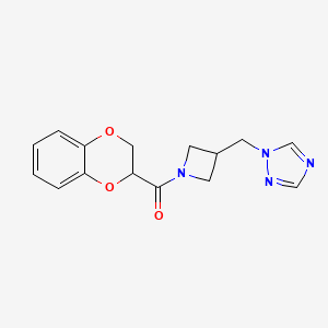 molecular formula C15H16N4O3 B2981700 (3-((1H-1,2,4-triazol-1-yl)methyl)azetidin-1-yl)(2,3-dihydrobenzo[b][1,4]dioxin-2-yl)methanone CAS No. 2309539-39-5