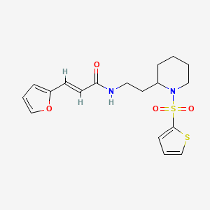 (E)-3-(furan-2-yl)-N-(2-(1-(thiophen-2-ylsulfonyl)piperidin-2-yl)ethyl)acrylamide